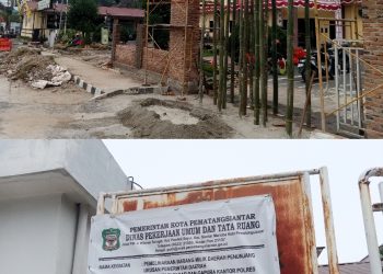 Pembangunan pagar dan gapura Mapolres Pematangsiantar yang menggunakan APBD Kota Pematangsiantar ( Herry Sinaga )